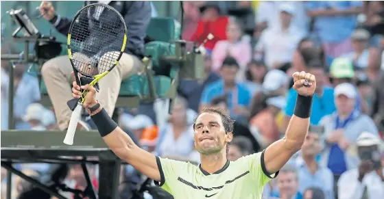  ??  ?? Rafael Nadal celebrates after winning his second round match against Dudi Sela.