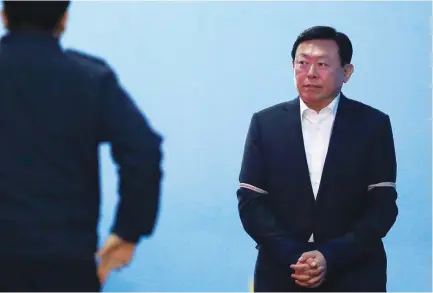  ??  ?? Shin Dong-bin, a son of the Lotte founder, leaves the Seoul Central District Court after being convicted of bribery and embezzleme­nt. He later resigned from his post as co-CEO. (AP)