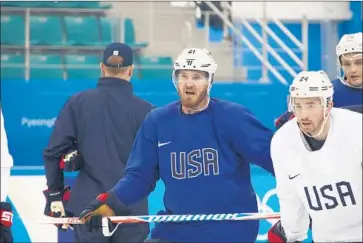  ?? Bruce Bennett Getty Images ?? JAMES WISNIEWSKI, left, who had two stints with the Ducks during his 552-game NHL tenure, thought his career was over after he tore his ACL in 2015. He gets another shot with the U.S. men’s hockey team.