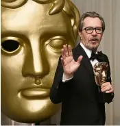  ??  ?? Actor Oldman poses with his Best Actor Award for Darkest Hour at the Bafta. — AP