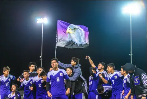  ??  ?? The Southwest High boys’ soccer team celebrates after defeated Calexico High, 1-0, on Tuesday night at Eagle Field in El Centro. PHOTO VINCENT OSUNA