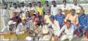  ?? HT ?? Divine Cricket Club players pose with winners trophy.