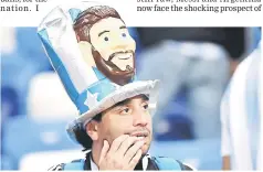  ??  ?? An Argentina’s fan reacts at the end of the match. — AFP photo