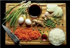  ?? Tribune News Service ?? ■ Cooks can switch up the flavors of their fried rice by combining the different flavor profiles suggested with the general cooking principles outlined in the basic recipe.