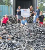  ??  ?? Right: Last week, a small group of volunteers loaded more than 460 good used bikes and spare parts into Bicycles for Humanity Victoria’s 10th container load of Bicycles for Africa.