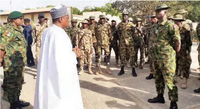  ?? PHOTO: ?? Minister of Defence, Mansur Dan-Ali addresses troops of Operation Sharan Daji at Gusau in Zamfara State yesterday. The troops are on ground in the state to stop the activities of armed bandits who have murdered scores of villagers
