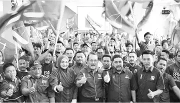  ??  ?? Halim (second right) and Nasrun during the launching of the Brigade Gerak Gempur Pemuda BN.