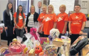  ??  ?? Great effort Lisa Brannen, second left, with her colleagues including branch manager Patricia Duff, third from right