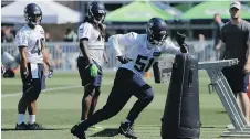  ?? AP ?? Seahawks linebacker Barkevious Mingo (51), seen at left running a drill during last month’s training camp in Renton, Washington, was the No. 6 overall pick in the NFL draft five years ago.