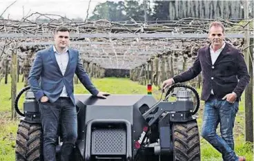  ??  ?? Robotics Plus’ chief technology officer Dr Alistair Scarfe (left) and co-founder Steve Saunders next to their company’s prototype UGV (unmanned ground vehicle).