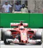  ?? ALEXANDER NEMENOV/AFP ?? Ferrari’s Sebastian Vettel steers his car during the first practice session of the Formula One Azerbaijan Grand Prix at the Baku City Circuit on June 23.