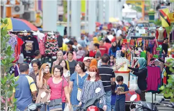  ??  ?? While the new regulation seem to apply to certain classes of goods, businesses might increase prices for other products and services, which would eventually push Malaysia’s CPI higher. — Bernama photo