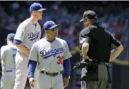  ?? RICK SCUTERI — THE ASSOCIATED PRESS ?? In this Thursday, May 3, 2018, file photo, Los Angeles Dodgers manager Dave Roberts (30) walks off the mound after a visit during the first inning during a baseball game against the Arizona Diamondbac­ks in Phoenix. Onequarter of the way into the...