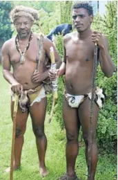  ??  ?? TRADITIONA­L GARB: Chief Khoisan SA, left, and Shane Plaatjies wore jackal skin loincloths and carried a bow and quiver of metal- tipped arrows as well as a pact stick, which is a hollow piece of decorated bamboo used in the same way as shaking hands