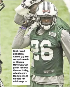  ?? AP ?? First-round pick Jamal Adams (l.) and second-rounder Marcus Maye wear Jet green for first time on Friday, when team’s top selections hit field for minicamp.