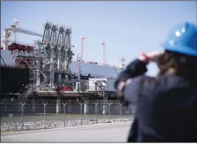  ?? (Bloomberg (WPNS)/Mark Felix) ?? An LNG Tanker vessel waits to be loaded at the Cheniere Sabine Pass Liquefacti­on facility in Cameron, La. in April.