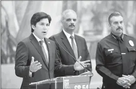  ?? AP/MARK J. TERRILL ?? California state Senate President pro Tempore Kevin de Leon (left), former U.S. Attorney General Eric Holder (center) and Los Angeles Police Chief Charlie Beck hold a news conference June 19 to discuss the proposed so-called California “sanctuary state...