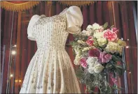  ??  ?? PRINCESS BRIDE: The Norman Hartnell dress worn by Princess Beatrice when she married Edoardo Mapelli Mozzi in July, above right, which is going on public display at Windsor Castle from today.