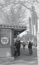  ??  ?? The University of Pittsburgh’s Cathedral of Learning overlooks the Conflict Kitchen in Pittsburgh. The Conflict Kitchen offers a changing menu inspired by the cuisine of nations with which the U.S. has been in conflict such as Iran and Cuba.