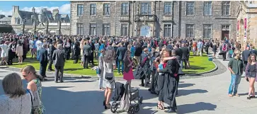  ?? Picture: Steven Brown. ?? Graduates pack out St Salvator’s Quad.