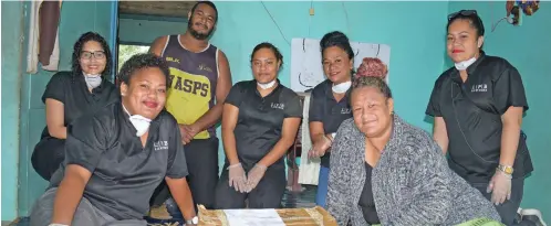  ?? Photo: Ronald Kumar ?? Lal Patel Bale Lawyers staff (from left) Asena Vole, Kya Lal, Nora Vaise, Lily Ali and Elenoa Qalo with Ulavia Tawake, 46, and her son Maikeli Naqarase, 23, after handing the food ration pack to the family on April 30, 2020.