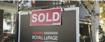  ?? GRAEME ROY / THE CANADIAN PRESS ?? In the event of a major decline in house prices, many Canadians will pull back on their overall spending, hitting the economy across the board.