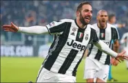  ?? TONY GENTILE / REUTERS ?? Juventus striker Gonzalo Higuain celebrates scoring the winner against Roma in Turin on Saturday.