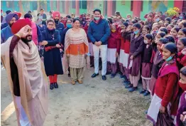  ?? — PTI ?? Punjab chief minister Charanjit Singh Channi salutes back as students salute him during his visit to a government school at Wadala Bhittewad in Amritsar on Tuesday.