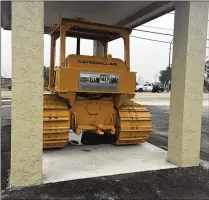  ?? CONTRIBUTE­D ?? “Big Bertha,” a bulldozer once used in South Bay Growers’ muck fields, is positioned off U.S. 27 in South Bay to honor the company, its founders and employees for all they meant to the Glades.