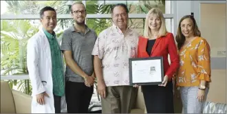  ?? Photo courtesy Maui Health System ?? From left, Cardiologi­st Kimble Poon, MD, Kaiser Permanente Hawaii; Joshua Farrell-Starbuck, MD (heart failure champion), Hospitalis­t, Maui Medical Group; Michael Rembis, CEO of Maui Health System; Leslie Lexier, BSN, RN and heart failure lead; and Lani Go-Keala, Executive Director Hawaii Division of the American Heart Associatio­n, receive the Gold Plus Target Heart Failure Honor Roll award in 2019.