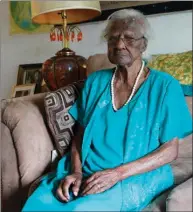  ??  ?? Jeralean Talley poses for a photo on May 22, 2014, in Inkster, Mich. The 115-year-old Detroit-area woman, born on May 23, 1899, tops a list maintained by the Los Angeles-based Gerontolog­y Research Group which tracks the world’s longest-living people.