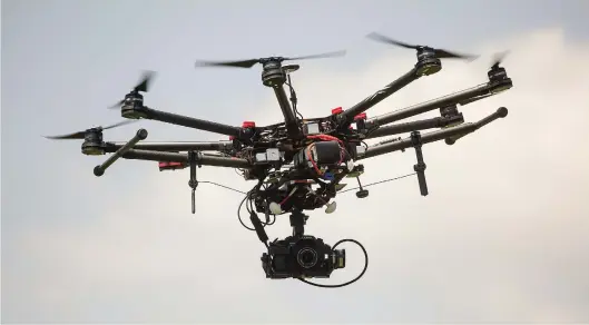  ?? Picture: Bloomberg ?? BIG BROTHER ON STEROIDS. Insuring your gadgets is advisable, as they could easily be damaged. A gust of wind can shift your drone off course and into a tree, or the battery could die while flying over a body of water.