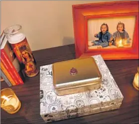  ??  ?? A PHOTOGRAPH of the sisters as babies is displayed on a shelf.