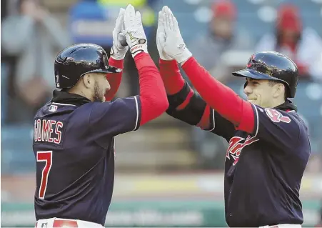  ?? AP PHOTO ?? HAVING A BLAST: The Indians’ Bradley Zimmer (right) celebrates with Yan Gomes after both scored on Zimmer’s two-run home run in last night’s 2-0 victory against the Tigers in Cleveland.