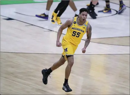  ?? DARRON CUMMINGS - STAFF, AP ?? Michigan guard Eli Brooks celebrates after making a 3-point basket during the second half of a second-round game against LSU in the NCAA men’s college basketball tournament at Lucas Oil Stadium Monday, March 22, 2021, in Indianapol­is.