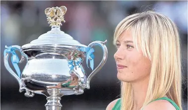  ??  ?? Sharapova holds the Australian Open trophy in 2008.