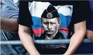  ?? AP ?? A man wearing a shirt showing a picture of Russian President Vladimir Putin attends a protest against a festival ‘’Mirdita-Dobar Dan’’ organised by liberal groups from Serbia and Kosovo in Belgrade, Serbia, yesterday. Serbian police have prevented...