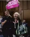  ?? J. SCOTT APPLEWHITE/AP ?? A protester interrupts Brett Kavanaugh’s testimony Thursday.