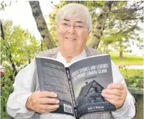  ?? SALLY COLE/THE GUARDIAN ?? Author Julie Watson holds a copy of “Ghost Stories and Legends of Prince Edward Island Second Edition”. Her first book, published by Dundurn in 1983, was so popular the publishing company asked to reprint it. Photograph­y is by John Watson.