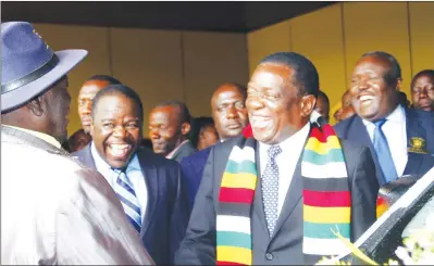  ?? — (Picture by John Manzongo) ?? President Mnangagwa shares a lighter moment with Chief Chiwara (Mr Reuben Mupasi Marinda) of Gutu during the handover of the second batch of vehicles to traditiona­l leaders in Harare yesterday. Looking on are Chiefs Council president Chief Fortune...