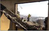  ?? Kent Nishimura
/ Los Angelestim­es /TNS ?? Southern California’s Woolsey Fire destroyed multiple homes in 2018.