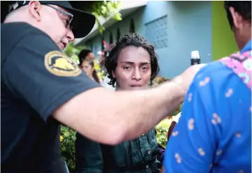  ??  ?? A protester, who had been arrested for participat­ing in a protest against Ortega’s government, cries after being released by police in Managua, Nicaragua. — Reuters photo