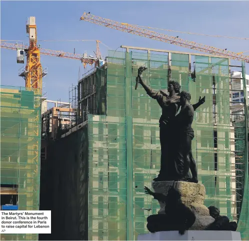  ??  ?? The Martyrs’ Monument in Beirut. This is the fourth donor conference in Paris to raise capital for Lebanon