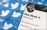  ?? REUTERS ?? Elon Musk’s Twitter profile is seen on a smartphone placed on printed Twitter logos on Thursday.