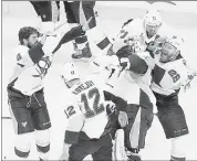  ?? ERIC RISBERG/ASSOCIATED PRESS ?? Penguins players celebrate around goalie Matt Murray (center) after beating the Sharks in Game 6 to win the Stanley Cup.