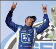  ?? BUTCH DILL — THE ASSOCIATED PRESS ?? Ricky Stenhouse Jr. (17) celebrates after winning the Camping World 500 auto race at Talladega Superspeed­way, Sunday in Talladega, Ala.