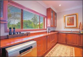  ??  ?? Solid wooden cabinetry is a feature of the kitchen.