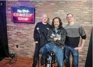  ?? Christian Abraham/Hearst Connecticu­t Media ?? New York Comedy Club owners Scott Lindner, Emilio Savone, middle, and Jim Panels, right, on the stage at the new comedy club in Stamford.