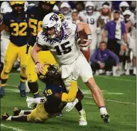  ?? Rick Scuteri / Associated Press ?? TCU quarterbac­k Max Duggan during the first half of the Fiesta Bowl against Michigan on Dec. 31 in Glendale, Ariz.