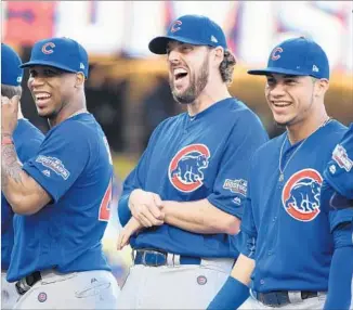  ?? Wally Skalij Los Angeles Times ?? JOHN LACKEY, center, shares a laugh during introducti­ons before Game 3 against the Dodgers. Lackey, 37, will take the mound for the Cubs today against 20-year-old Julio Urias.